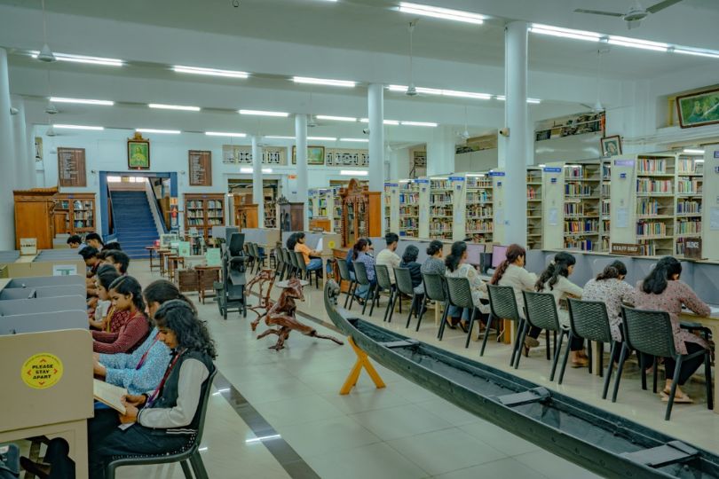 University students reading books in a library as part of AKTU's daily reading initiative.